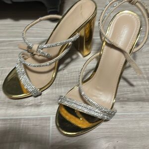 Size 7, never worn formal shoes in the color gold with silver accent